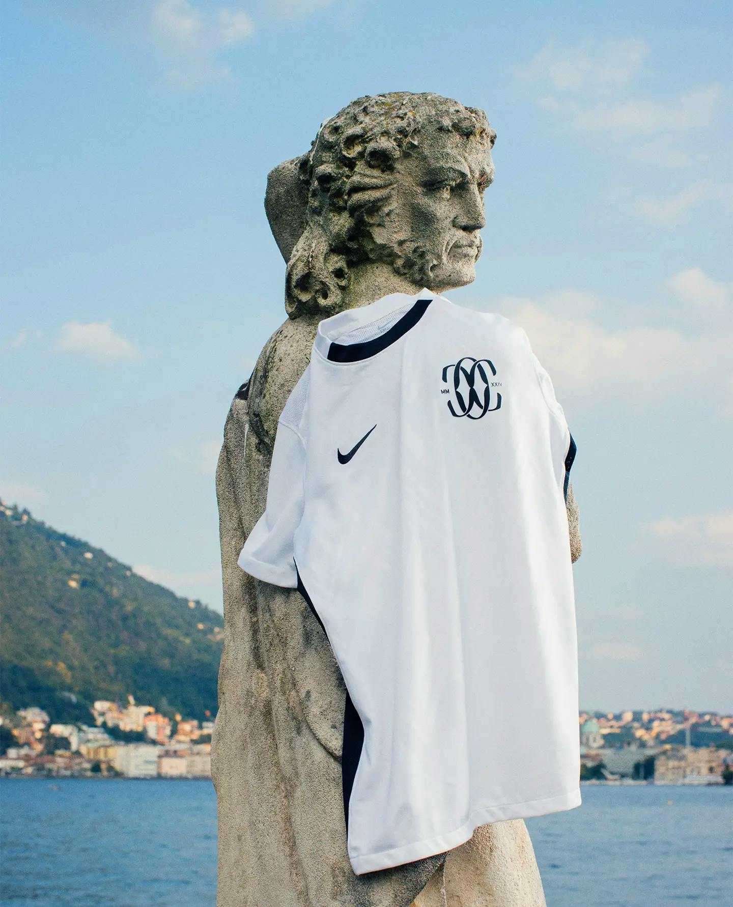 Como shirt hanging on a statue