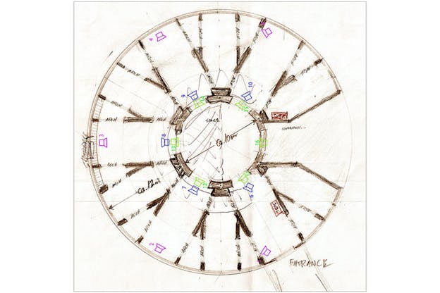 A sketch of a circular floor plan with a smaller circle in the middle. Around this, there are numerous walls which come off the center circle like spokes on a wheel. This otherwise brown sketch is interspersed by numerous speaker icons in green, blue, and pink oriented around the space. The entrance is marked in the bottom right of the circle. 