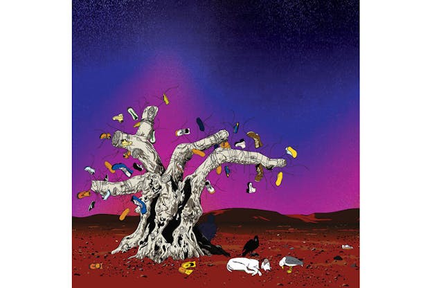 An image of a bare, grey tree with numerous multicolored shoes tied onto it. Beside the tree, there is a vulture, seagull, and a white dog which lays on its side with its tongue out. The ground is bright red and covered in pebbles. Short mountains of the same bright red are in the background. The sky is pink near the ground and blue on the top of the image. 