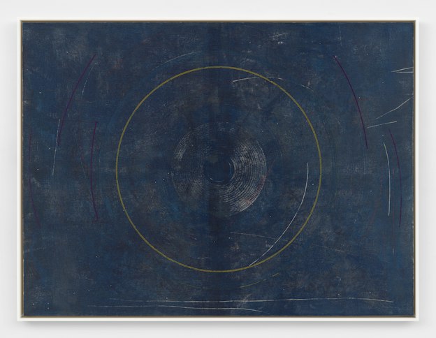 A framed screenprint depicting finely lined concentric rings of different colors centered against a deep indigo background. Magenta and orange curved lines appear outside of the central rings, along with light scratches of orange, white, and blue which distress the surface of the print.