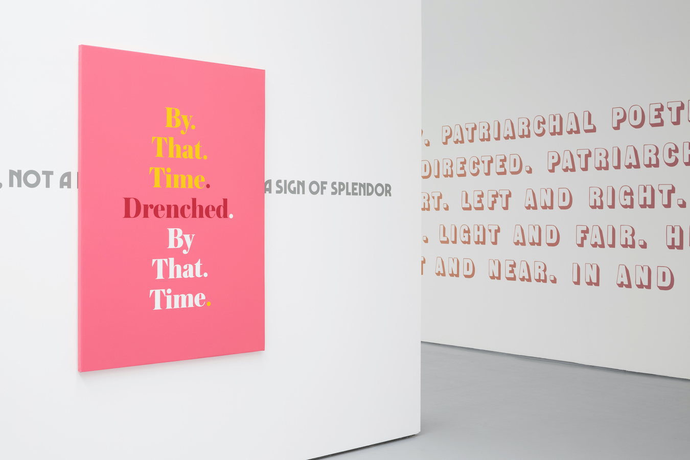 A gallery hall with light grey floors and white walls. On one wall, a pink canvas is illustrated with the words: 