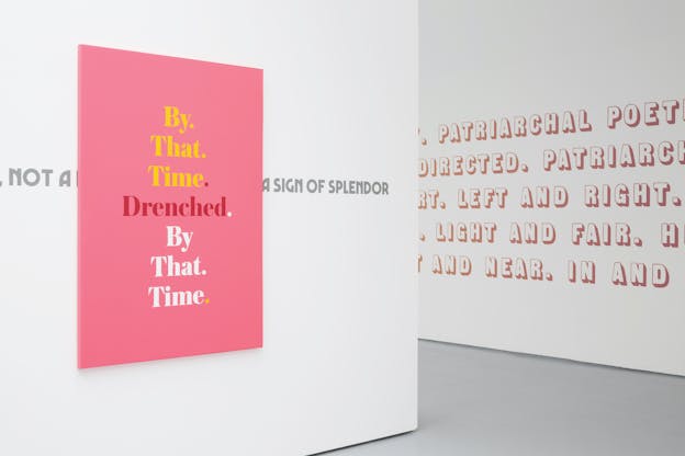 A gallery hall with light grey floors and white walls. On one wall, a pink canvas is illustrated with the words: 
