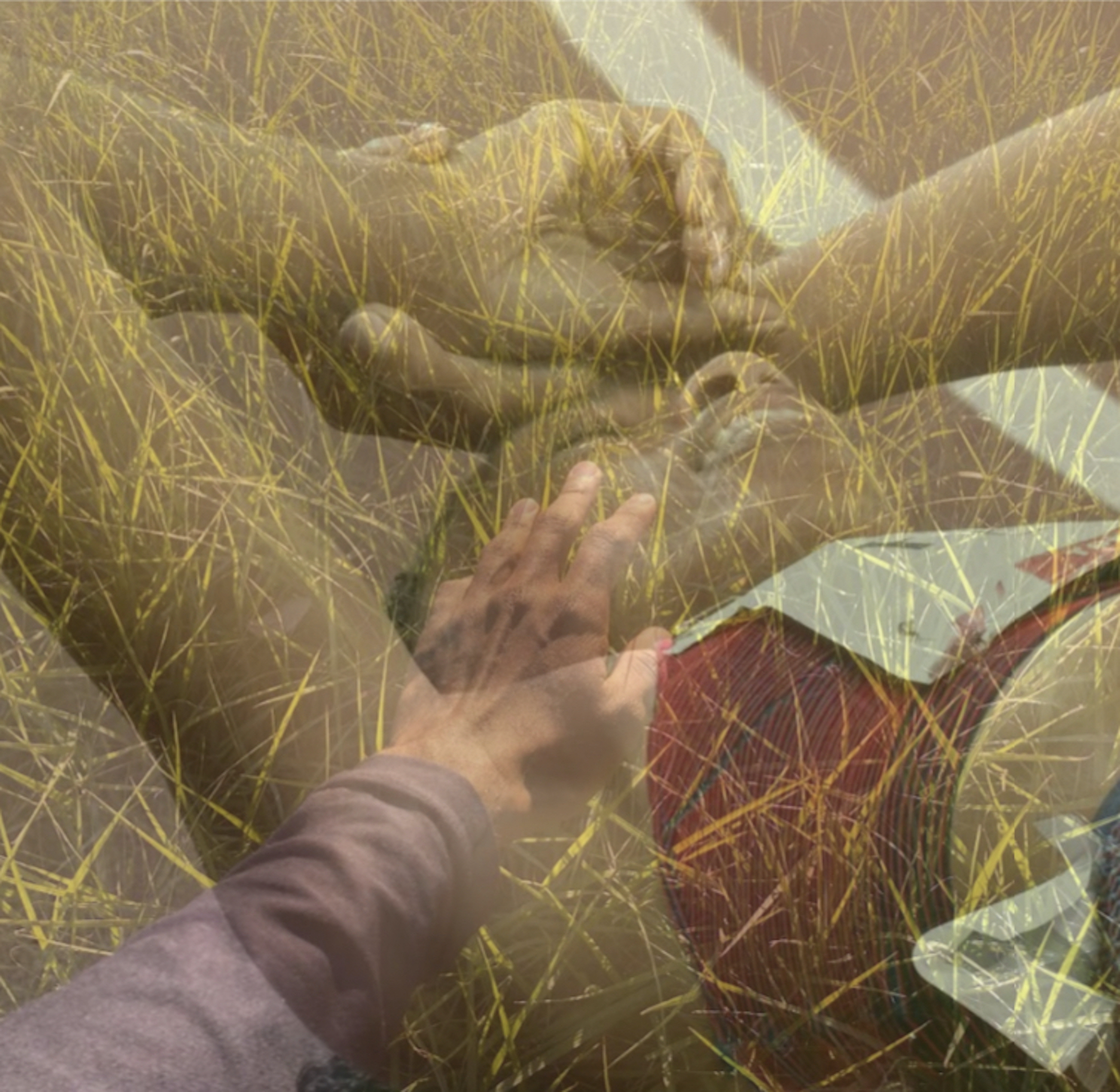 A photo collage made of multiple layered photos at partial opacity. One image is a closeup shot of an athlete laying down on a racing track, their arms raised, hands folded over their forehead, and their eyes are closed as they breathe through their mouth. Layered with this image is a closeup of grass, as well as a smaller, clothed arm that reaches out and touches the athlete's cheek. 