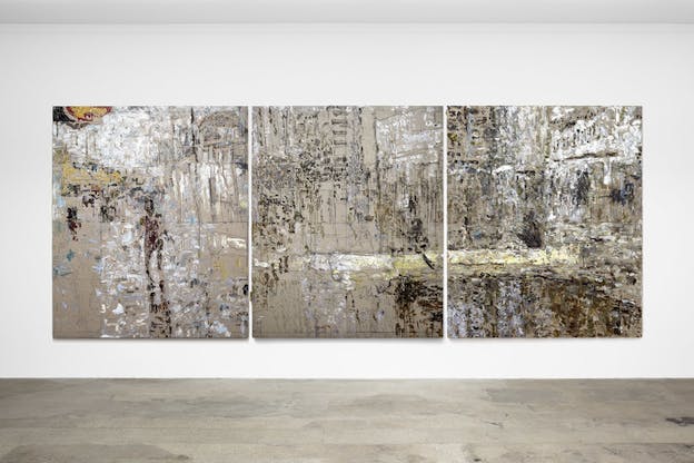 Three abstract paintings of white and brown colors hang next to each other depicting a panoramic view of silhouette walking near water and trees.