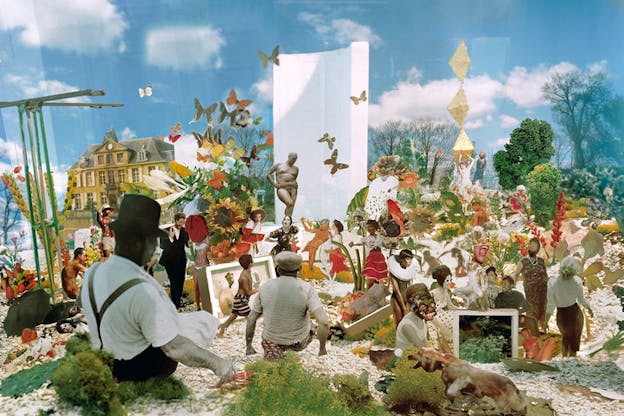 Saturated collage of a variety of cut-out figures juxtaposed with kale, butterflies, flowers, and birds, against a grainy blue sky with white clouds and in the corner left a yellow manor-style building.