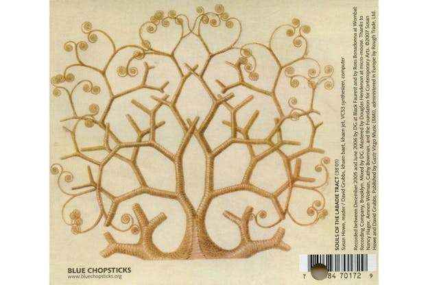 The back of an album cover with a golden brown tree branching upward into a spiral pattern. Album information in tiny black print and a barcode are located on the right and bottom sides of the cover.