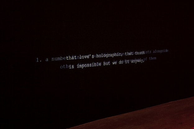 Overlapping white text on a black background reads 