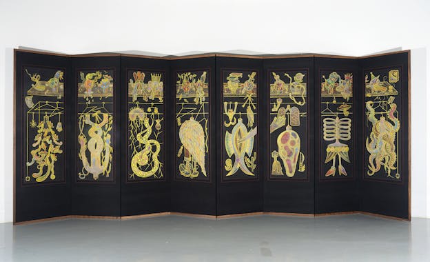 A black, eight-paneled room divider extends across a white-walled. The divider is framed on all sides by a narrow wooden border and each panel depicts an illustration of a colorful and cluttered closet, in which gilded flora, fauna, and hybrid forms hang from golden clothing racks.