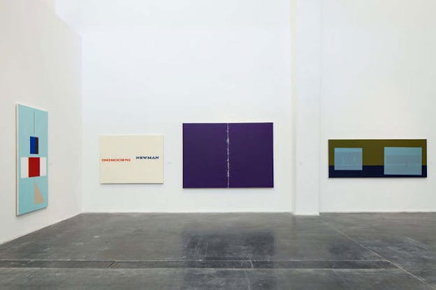 On the right wall, an abstract painting with a thin tan line above red, blue, black, and white rectangles above a tan triangle set against a cyan background. On the center wall from left to right a cream-colored painting with 