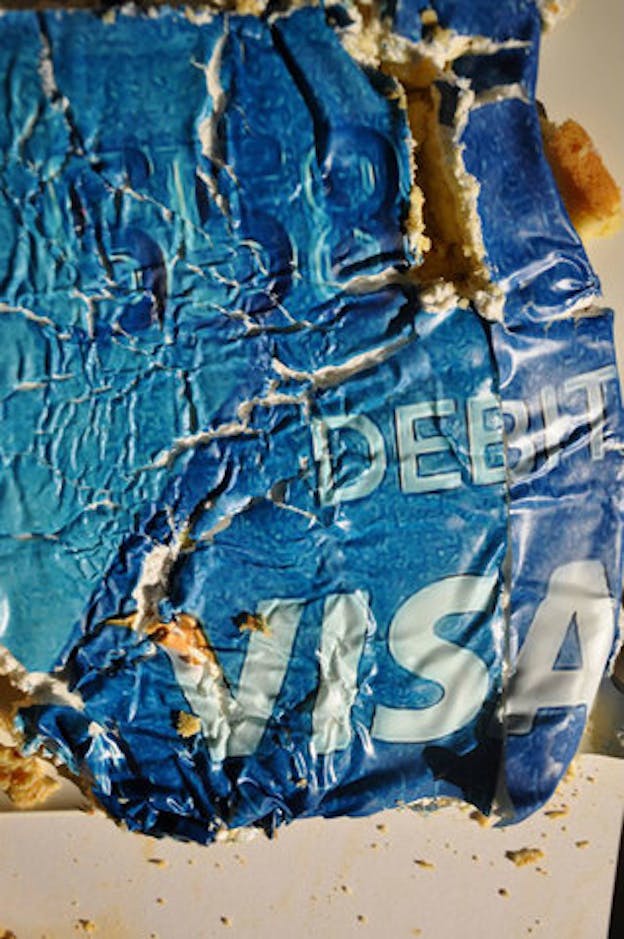 Close-up of a metallic blue crushed plastic and foam Debit, VISA card. 