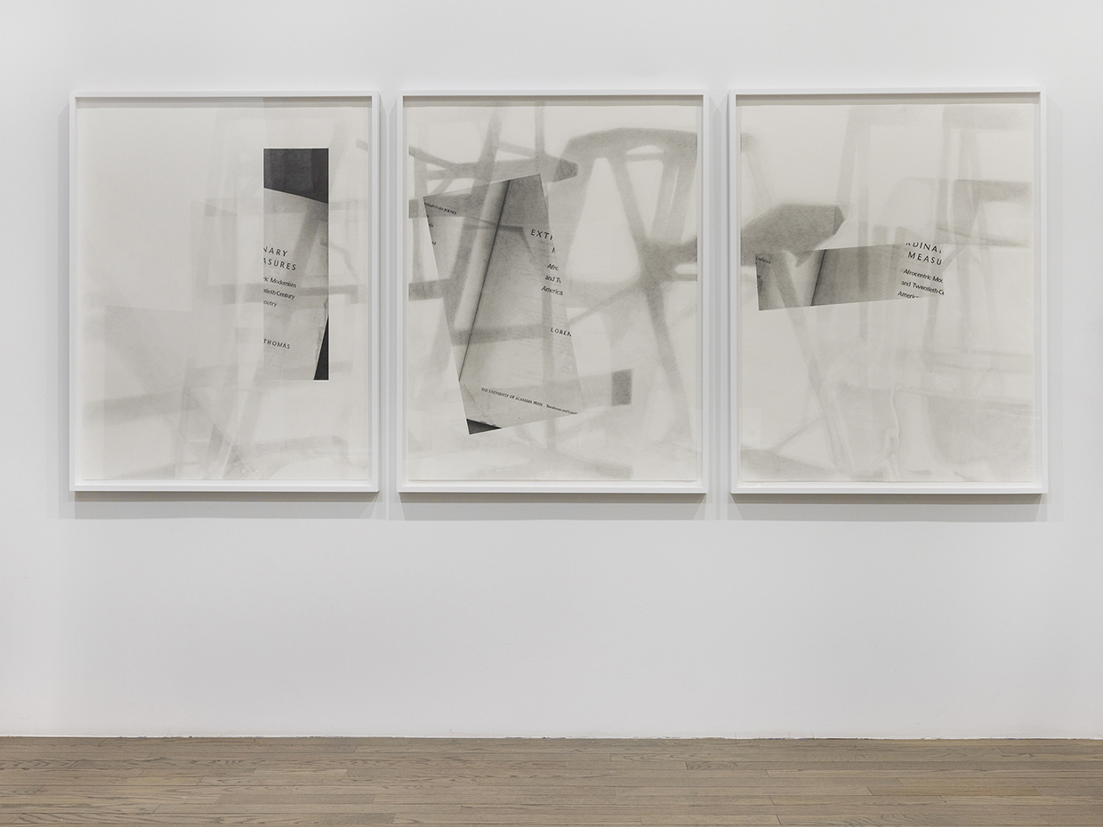 Three side by side graphite pencil prints on coventry rag paper with white frames.  Each of the three prints is 127 × 96.5 × 5.1 cm and includes a rectangular image  of a page in a book. They are out of order on the wall, but together, it can be  deduced that the heading on the incorporated page is “EXTRAORDINARY  MEASURES”. Other words throughout the three images include “Modernism”,   “Twentieth Century”, “and”, “Thomas”, “America”, and “Afrocentric”. Over the  images, again on all three of the prints, are large faded drawings in a light grey,  which appear to be of letters.