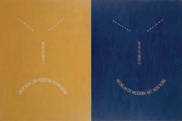 Two mirrored rectangles: left side is painted slate blue, white lettered and slanted 