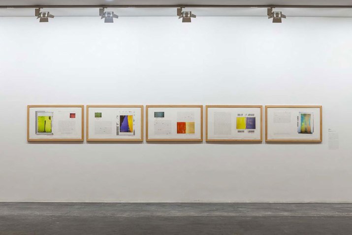 Five framed works juxtaposing faint text and rectangular brush strokes of earthy yellows, reds, violets, and firefly green and turquoise.