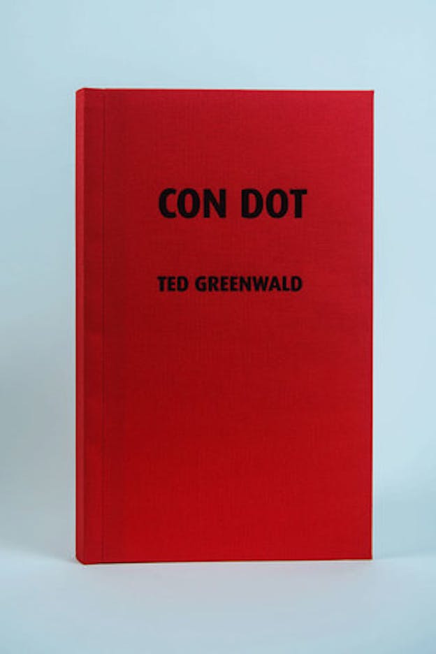 A cherry red book with the black text: 