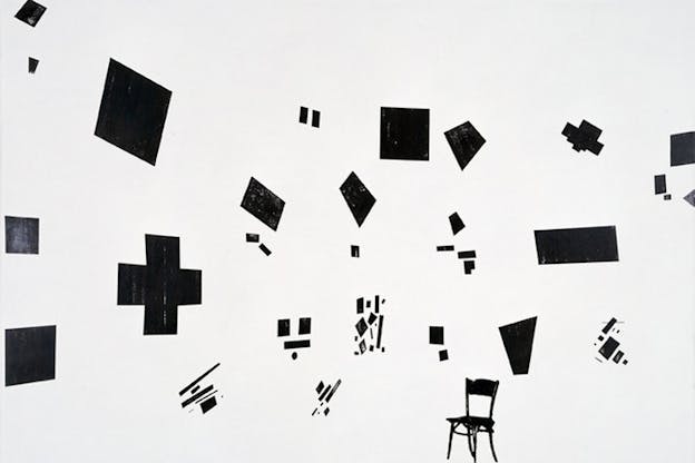 Black geometric shapes and lines float abstractly in white space above a black sketch of a chair. 