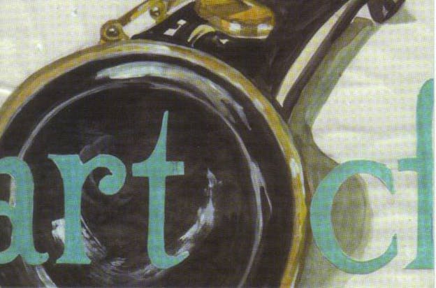 A close up of a black and gold mechanical object against a white background. Blue font at the bottom has gotten cut off, leaving only 