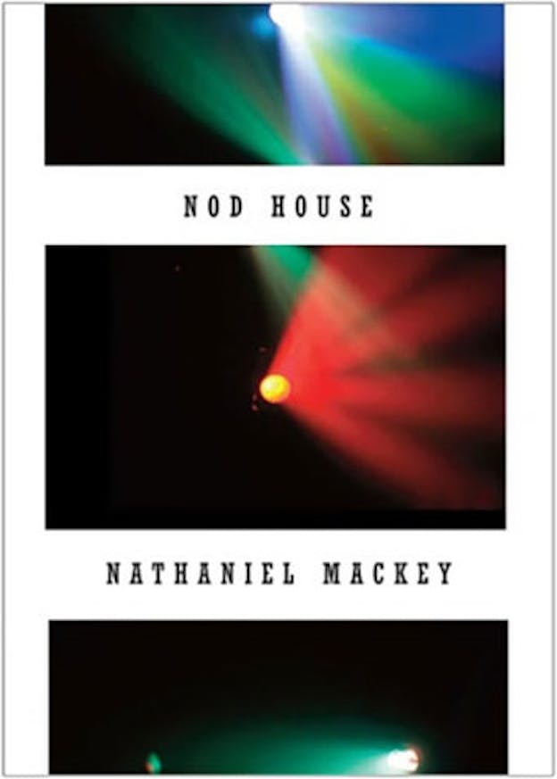 The cover is divided vertically into three images of blurred colored light on a black background. These images are bordered by white. On the white sections between images it says 