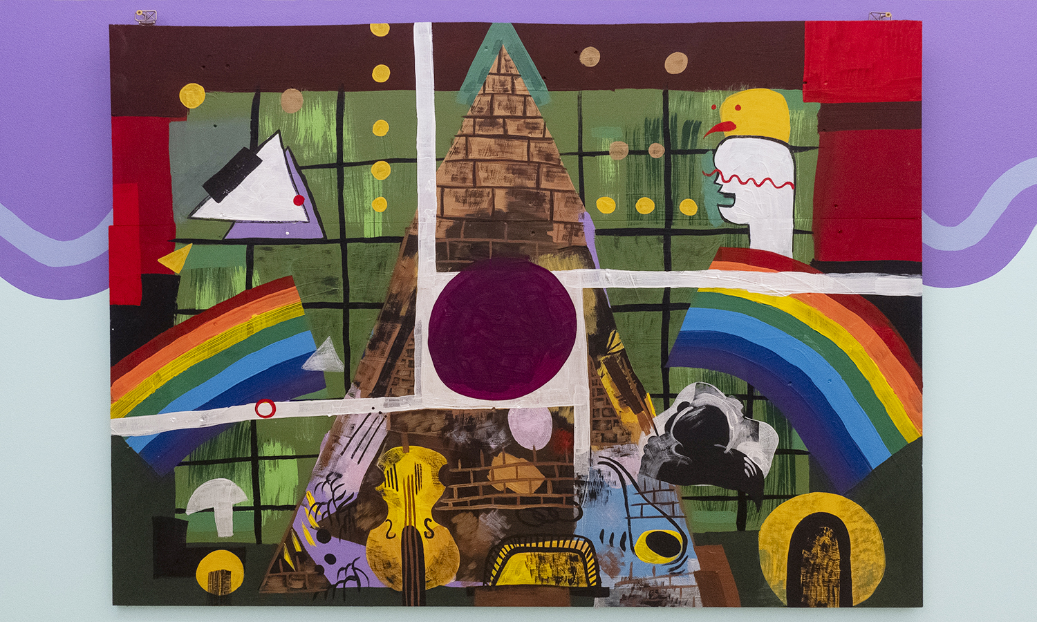 An abstract painting with two rainbows, a brick pyramid, a violin, and assorted colorful shapes mounted on a purple and blue wall.