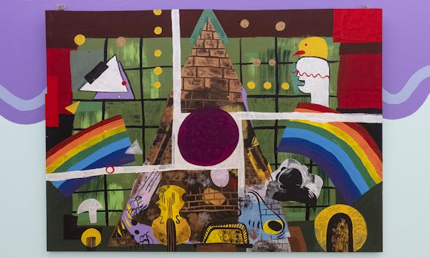 An abstract painting with two rainbows, a brick pyramid, a violin, and assorted colorful shapes mounted on a purple and blue wall.