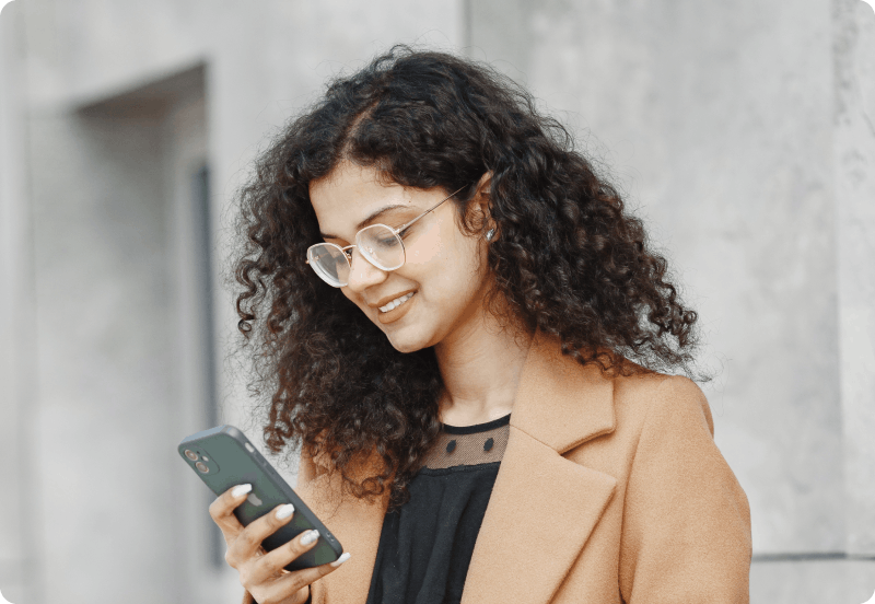 Woman checking her phone looking for insurance