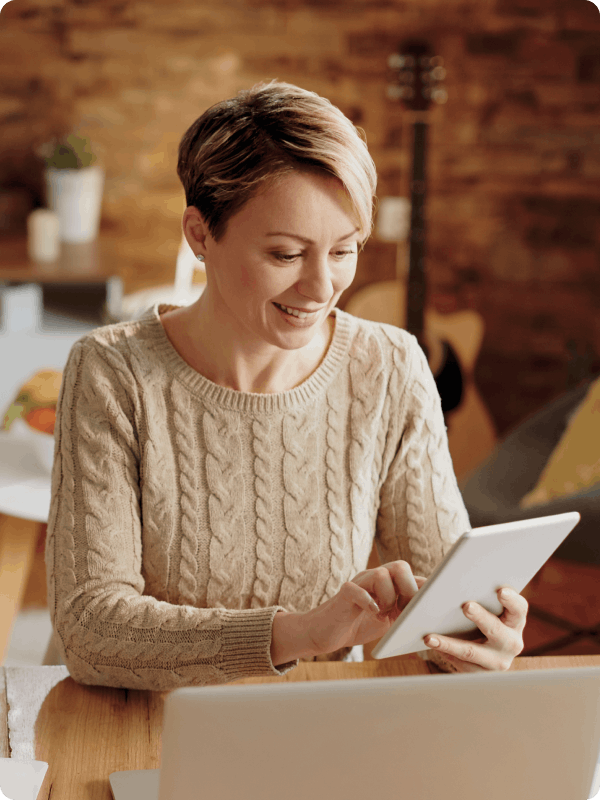 Woman looking at insurance options on a tablet.