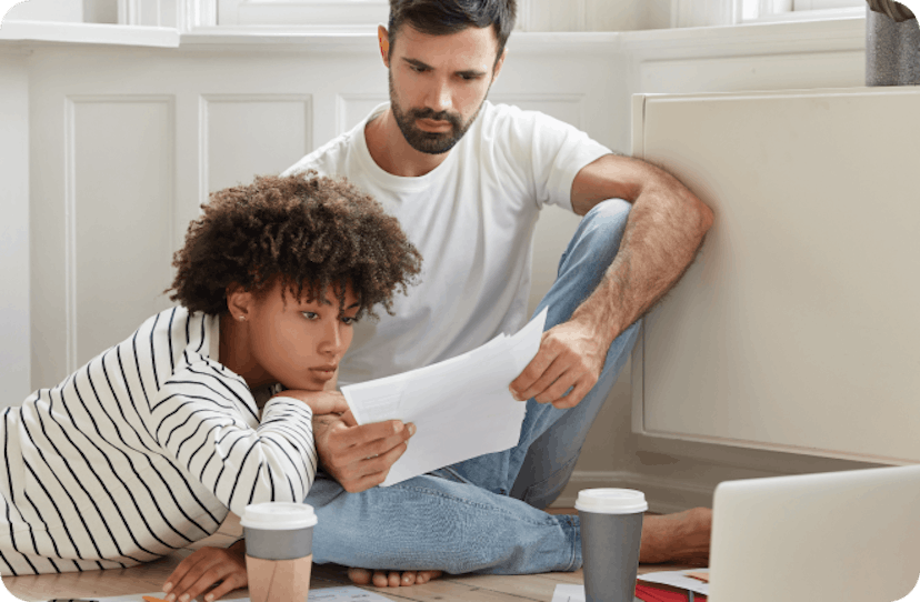 Couple reading letter from landlord