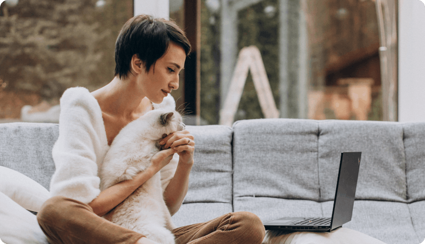 Woman and cat signing up for pet health insurance