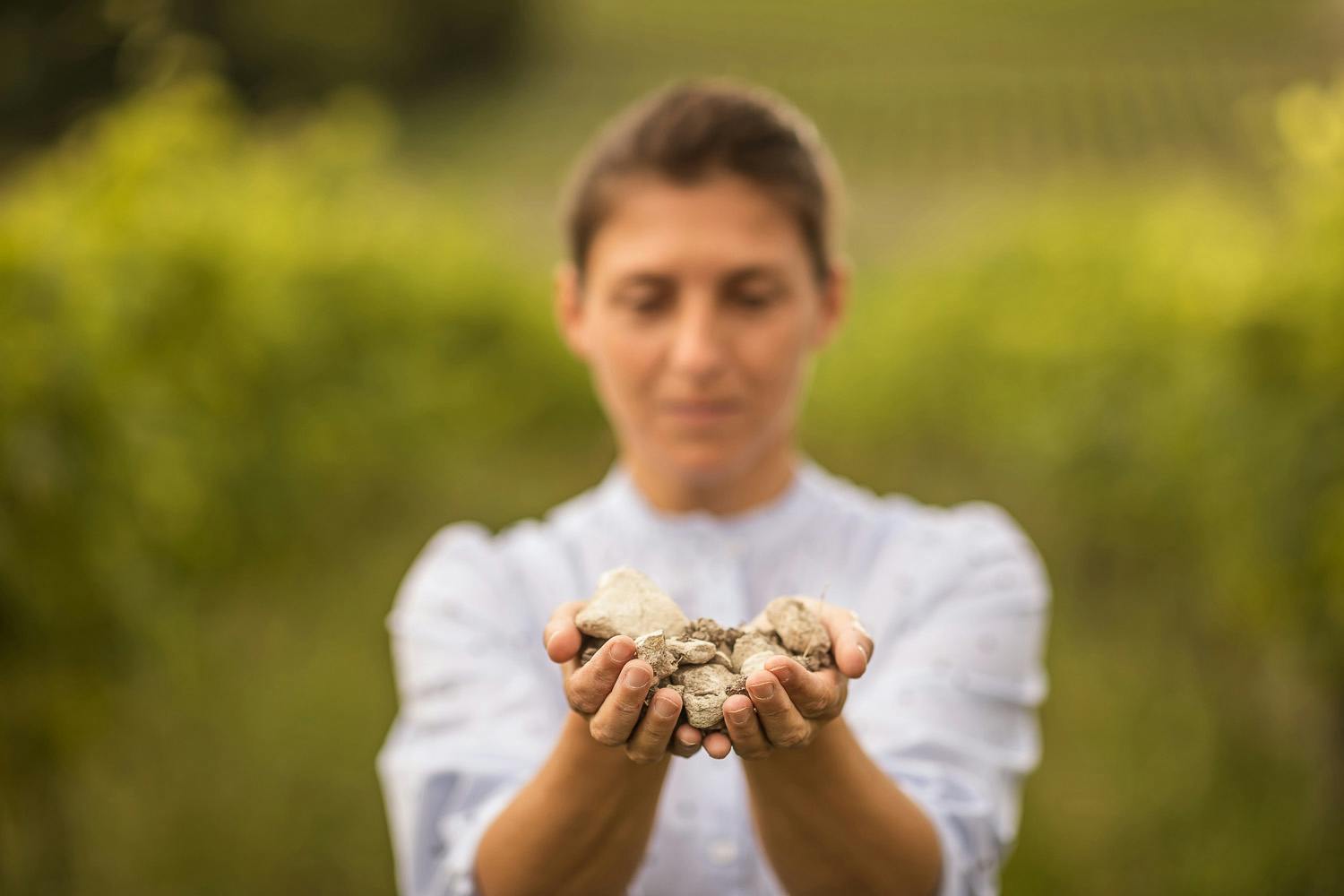 a woman holding rocks