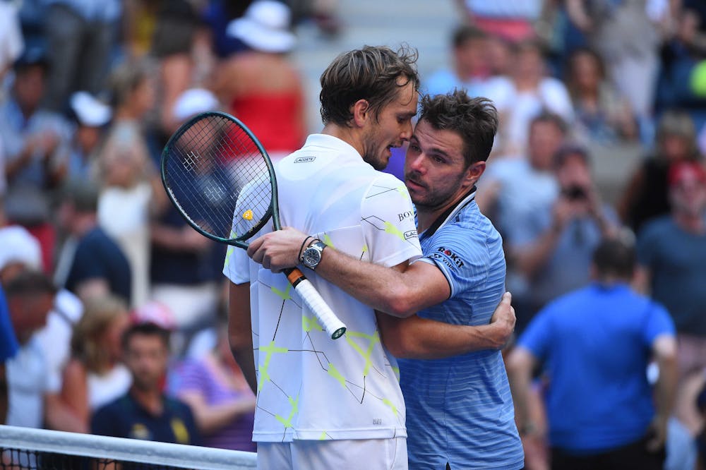 Daniil Medvedev and Stan Wawrinka at the net at the 2019 US Open