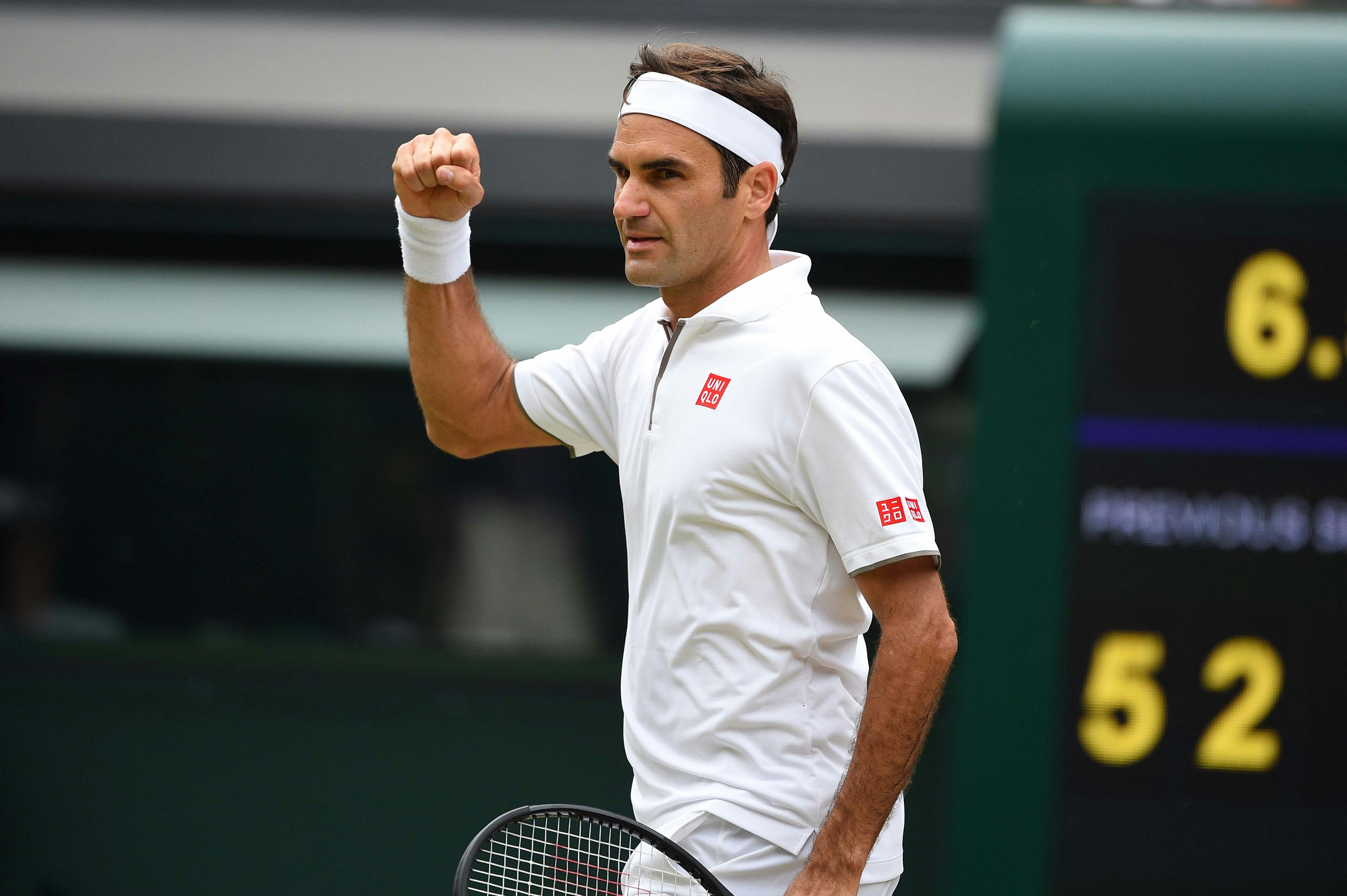 Roger Federer fist puming at Wimbledon 2019