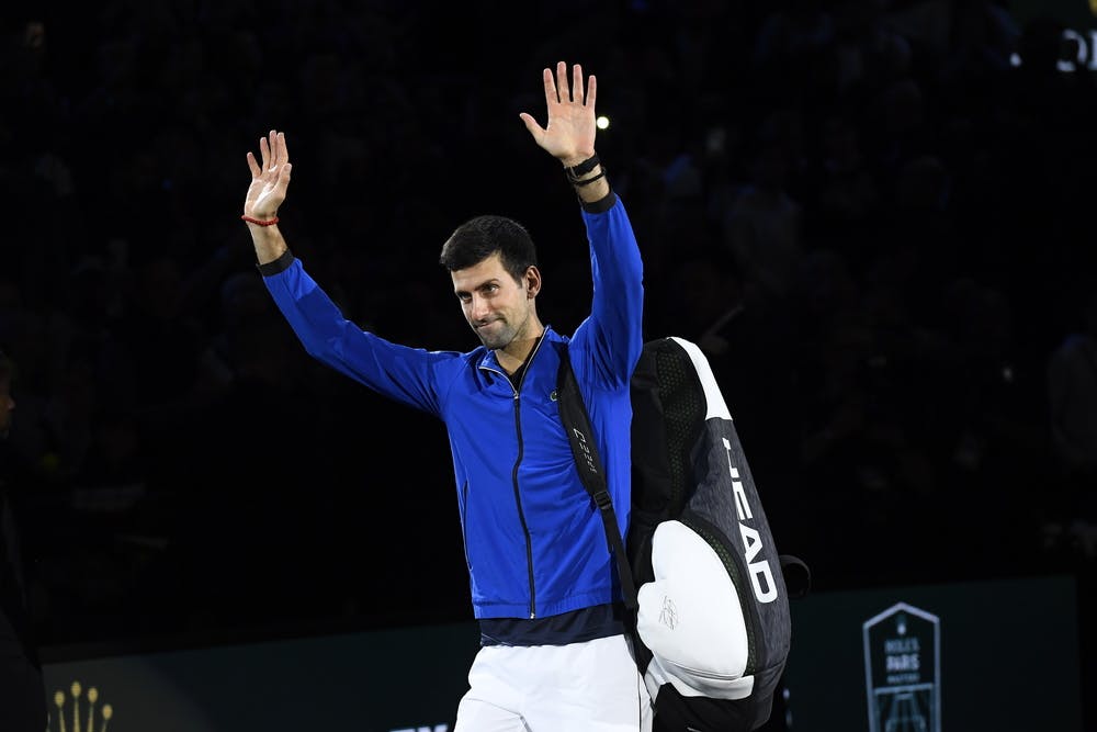 Novak Djokovic wawing to the crowd after his win at the Rolex Paris Masters 2019