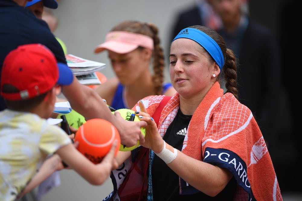Women's champion for 2017, Jelena Ostapenko, signs autographs on Kids Day.