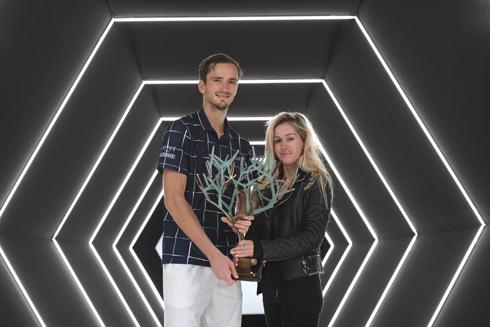 Daniil Medvedev and his wife Daria posing with the trophy at the Rolex Paris Masters 2020.