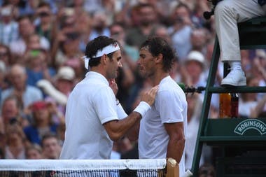 Rafael Nadal congratulates Roger Federer at the net after the Swiss won their semi final match-up at Wimbledon 2019