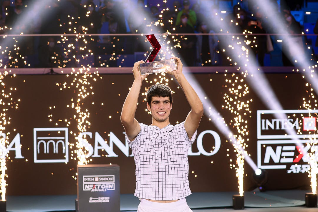 Carlos Alcaraz lifting the 2021 NextGen ATP Finals trophy