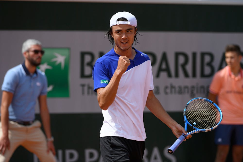 Taro Daniel of Japan in action during his first-round qualifying victory at Roland Garros 2018