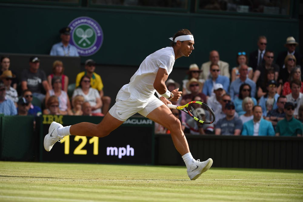 Rafael Nadal running for a shot against Nick Kyrgios at Wimbledon 2019