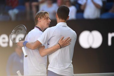 Denis Shapovalov congratuling Novak Djokovic at the net during the Australian Open 2019.