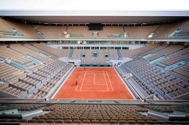 Lines being painted on the new Philippe-Chatrier court with the roof open.