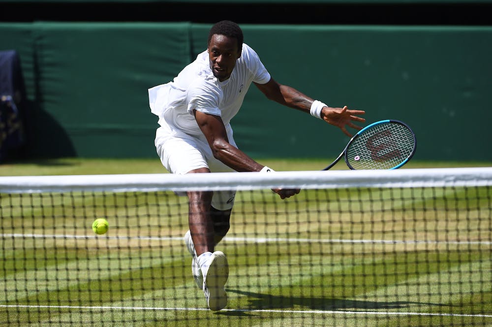 Gaël Monfils comes to the net at Wimbledon 2018.
