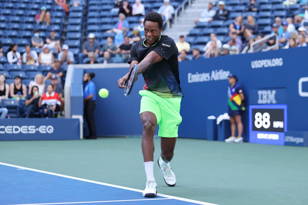 Gaël Monfils hitting a backhand in front of the crowd at the 2021 US Open