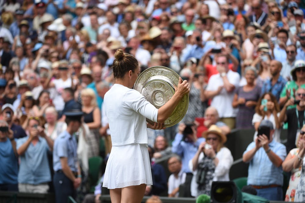 Simona Halep from behind with her trophy at Wimbledon 2019