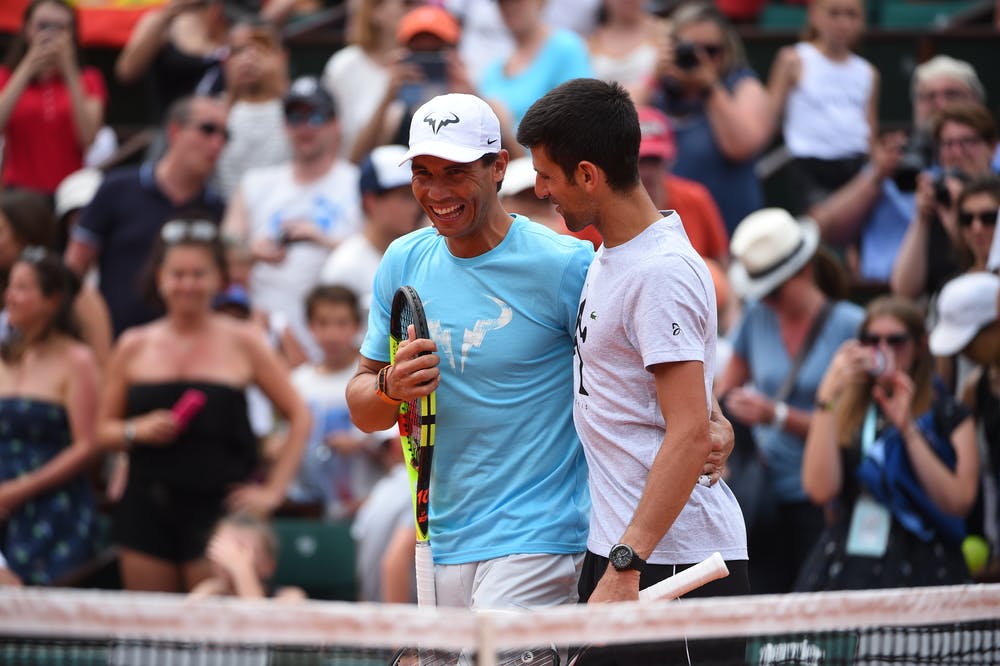 Novak Djokovic and Rafael Nadal laughing ar the 2018 Roland-Garros kids' day.