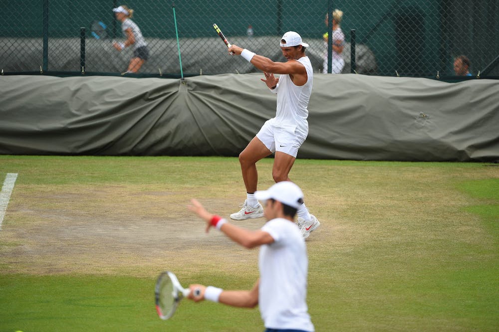 Rafael Nadal and Novak Djokovic practicing next to each other Wimbledon 2018