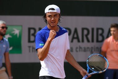Taro Daniel in action during his first-round qualifying victory at Roland Garros. 