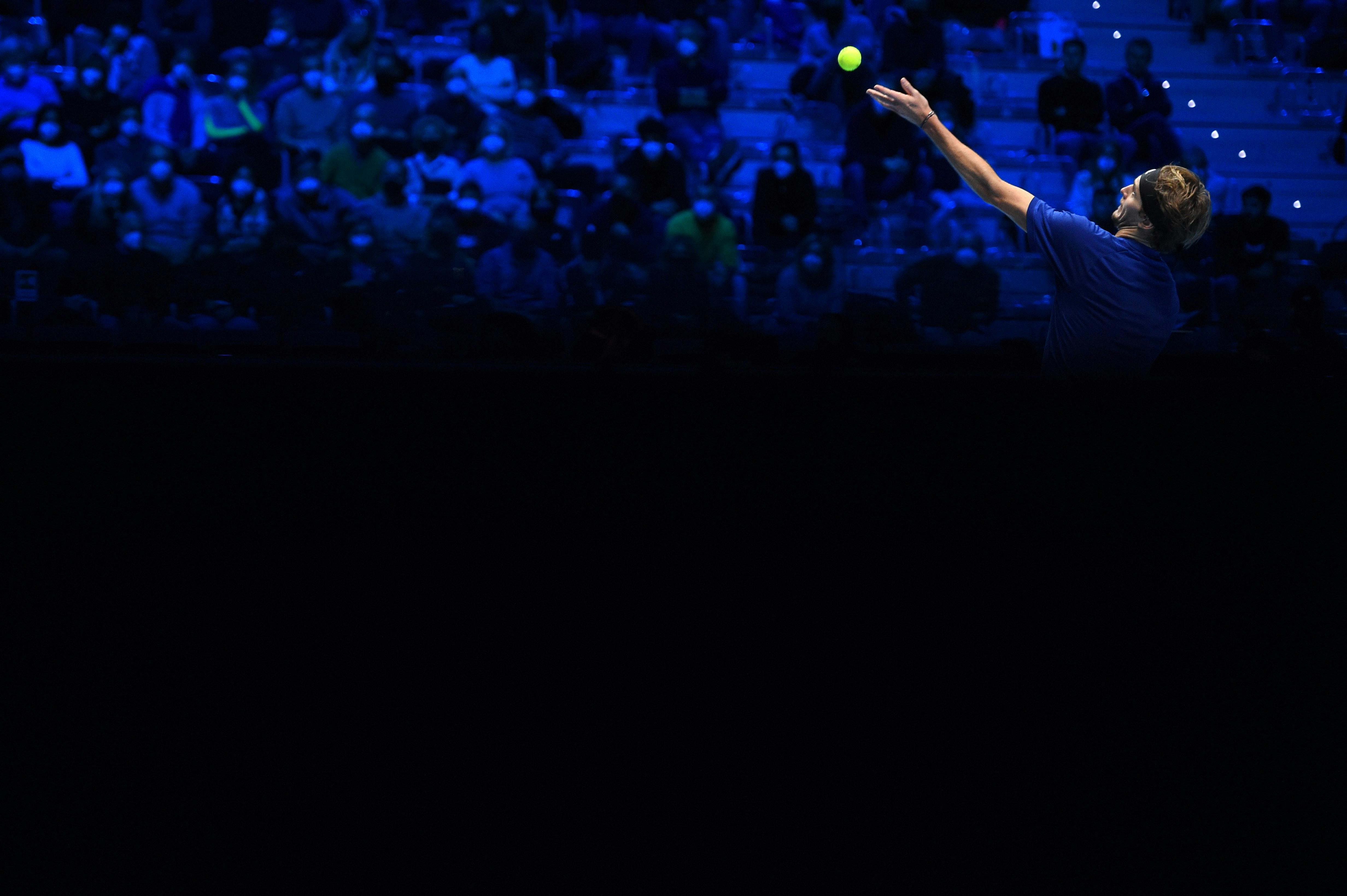 Alexander Zverev serving between light and shadow ATP Finals 2021