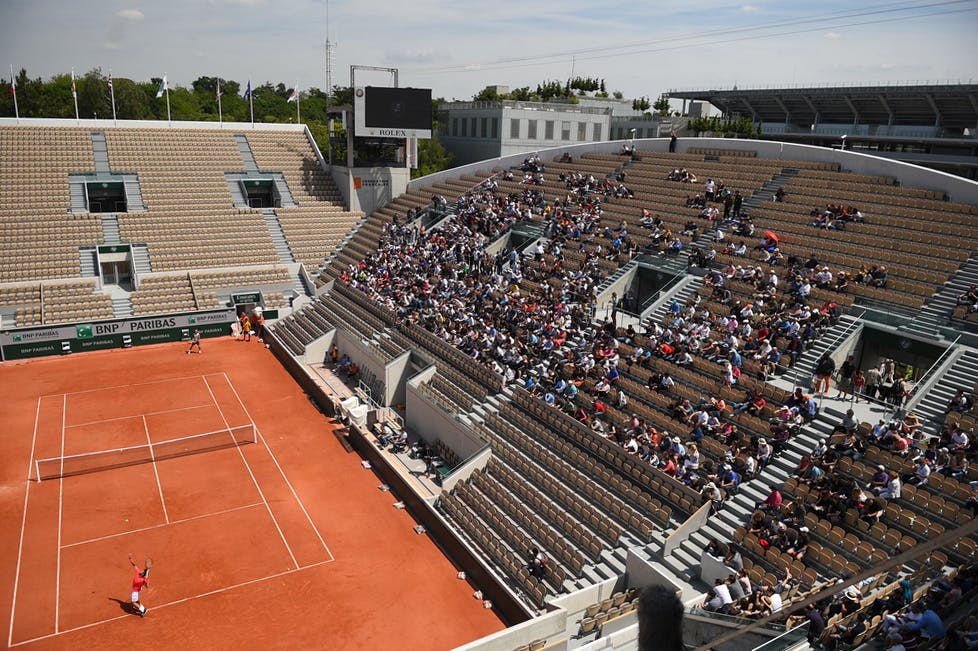 Fans watch Rafael Nadal practice on Court Suzanne-Lenglen.
