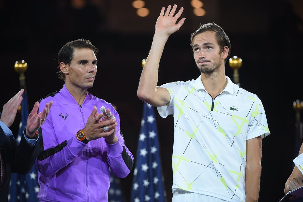 Daniil Medvedev wawing to the crowd on the podium at the 2019 US Open