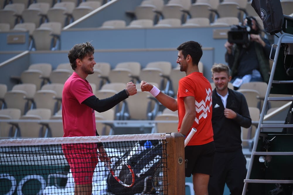 Dominic Thiem and Novak Djokovic at the net after a practice at Roland-Garros 2020