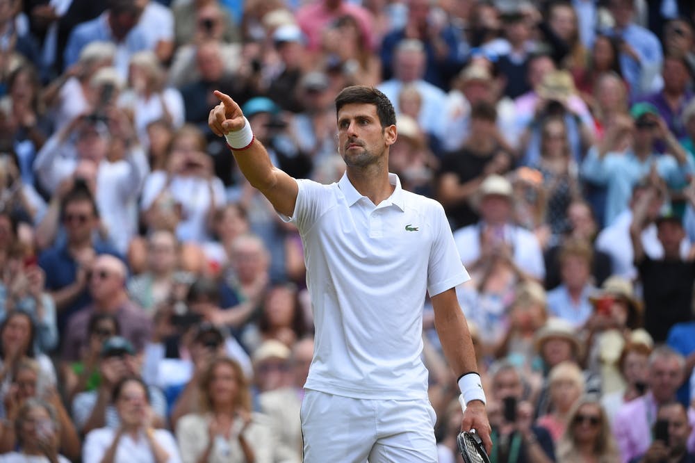 Novak Djokovic pointing at his box at the end of the Wimbledon 2019 final